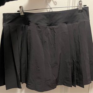 Pleated black lululemon skirt, size 12